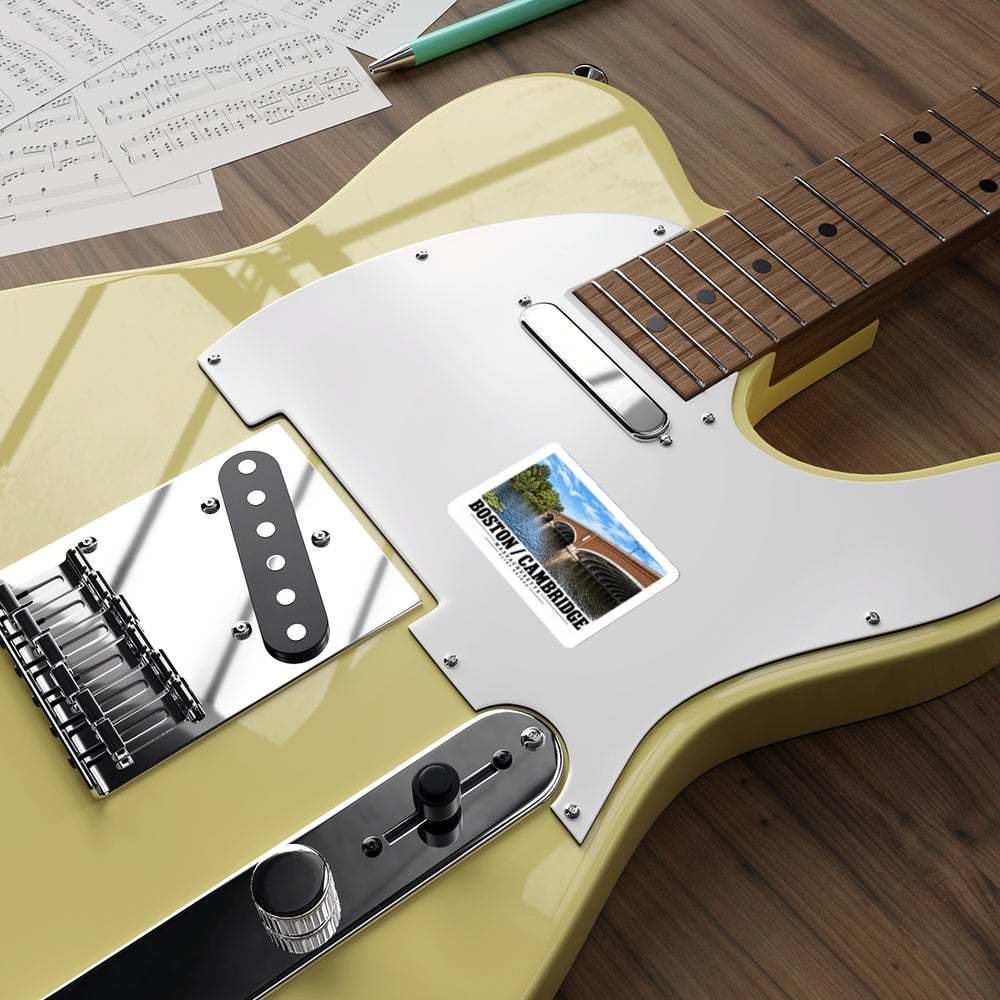Sticker showing Eliot Bridge close red brick arch view artwork on a pale yellow electric guitar