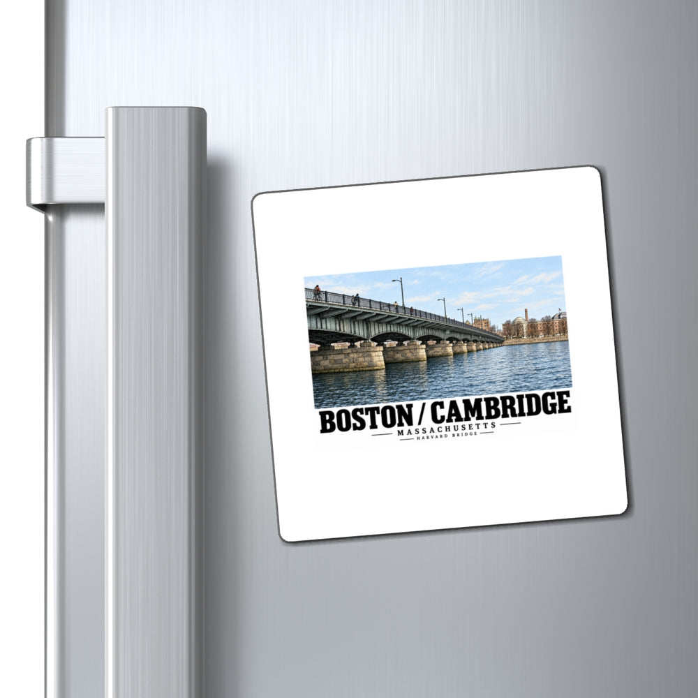 Magnet with Harvard Bridge artwork and Boston/Cambridge lettering on a refrigerator beside the handle