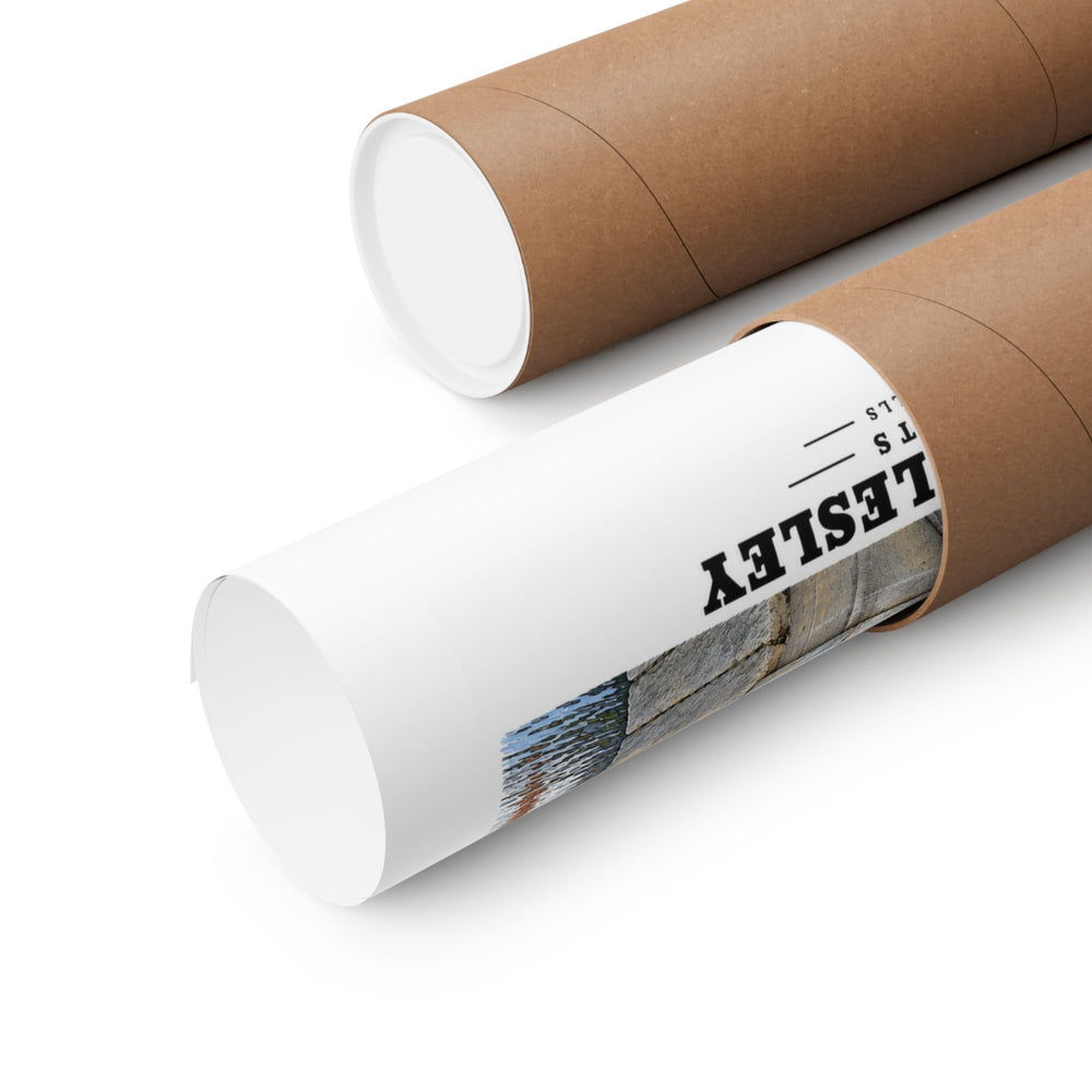Partly rolled poster extending from a cardboard tube with partial Wellesley lettering and a narrow strip of the printed scene visible