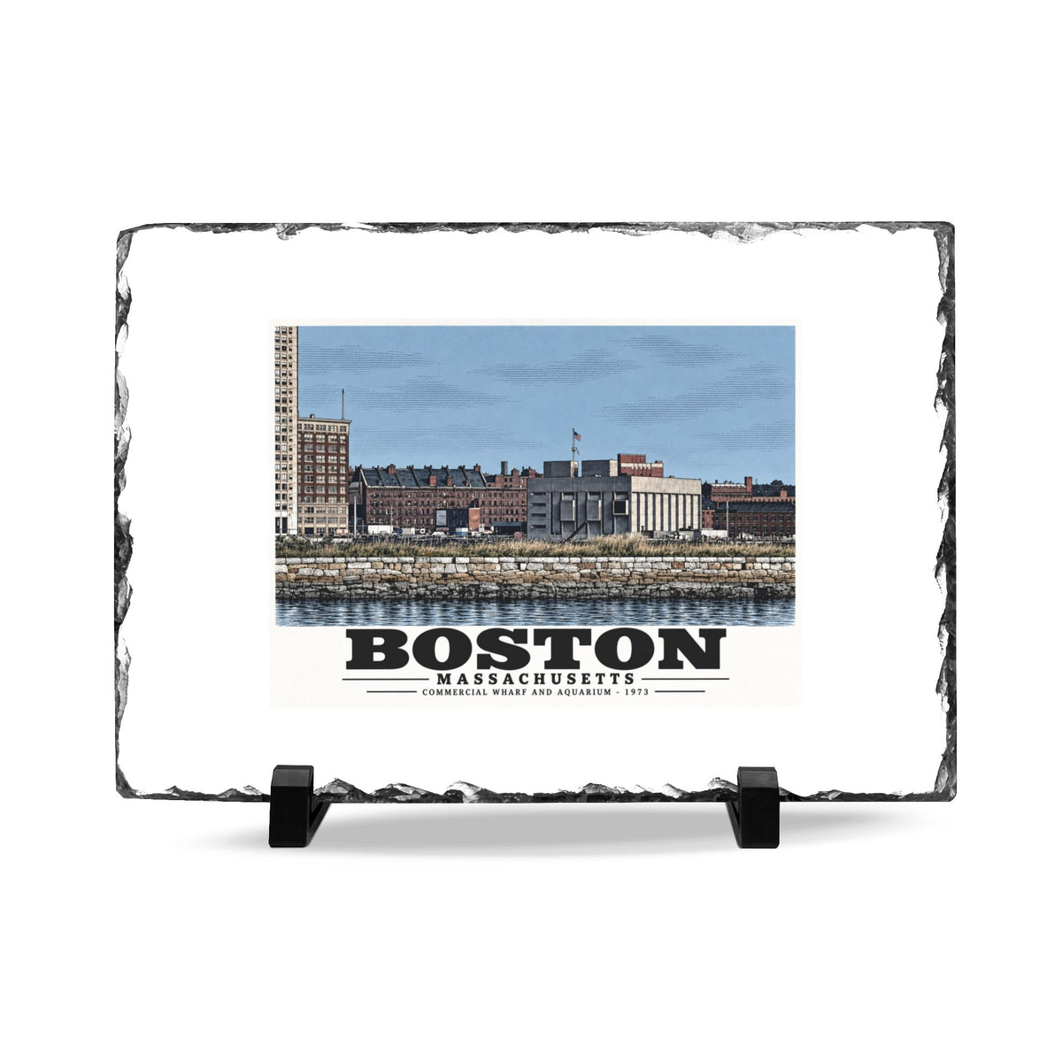 Rough-edged slate display on two black stands with Commercial Wharf and Aquarium waterfront buildings, stone seawall and harbor water artwork and Boston lettering