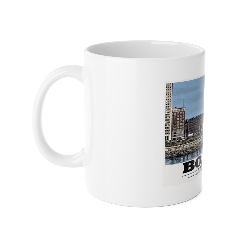 White mug with handle at left and part of the Commercial Wharf and Aquarium waterfront buildings, stone seawall and harbor water print at right