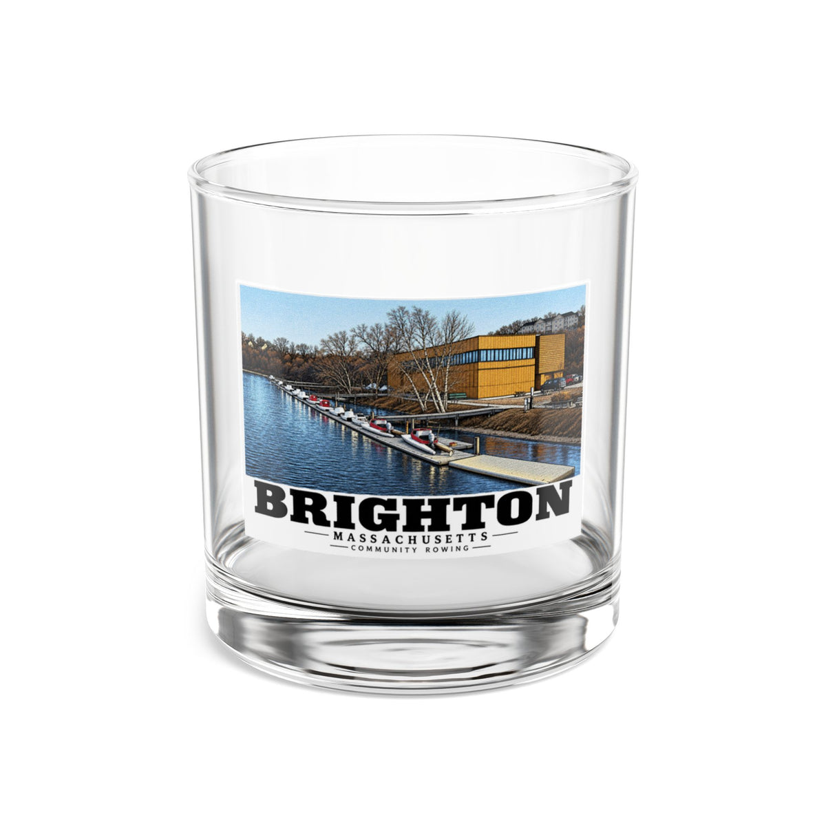 Clear rocks glass showing Community Rowing building, dock and boats artwork and Brighton lettering