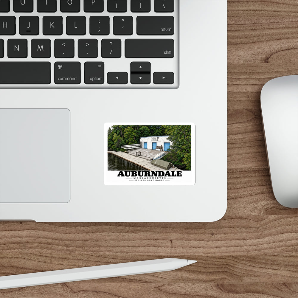 Auburndale Stoller Boathouse sticker on a laptop beside a keyboard and mouse.