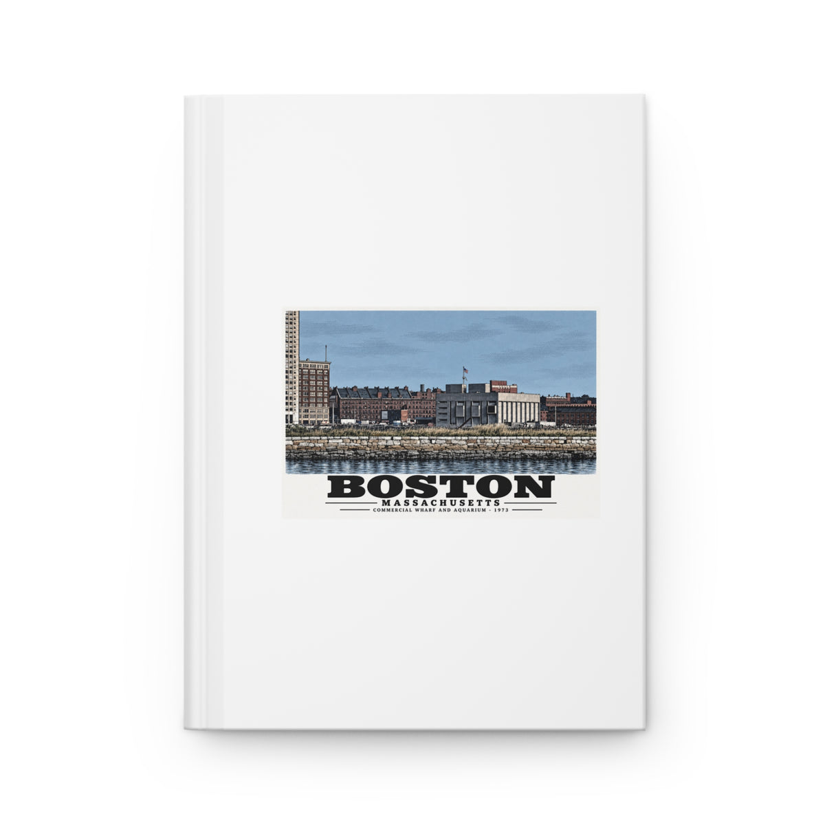 White hardcover journal with Commercial Wharf and Aquarium waterfront buildings, stone seawall and harbor water artwork and Boston lettering