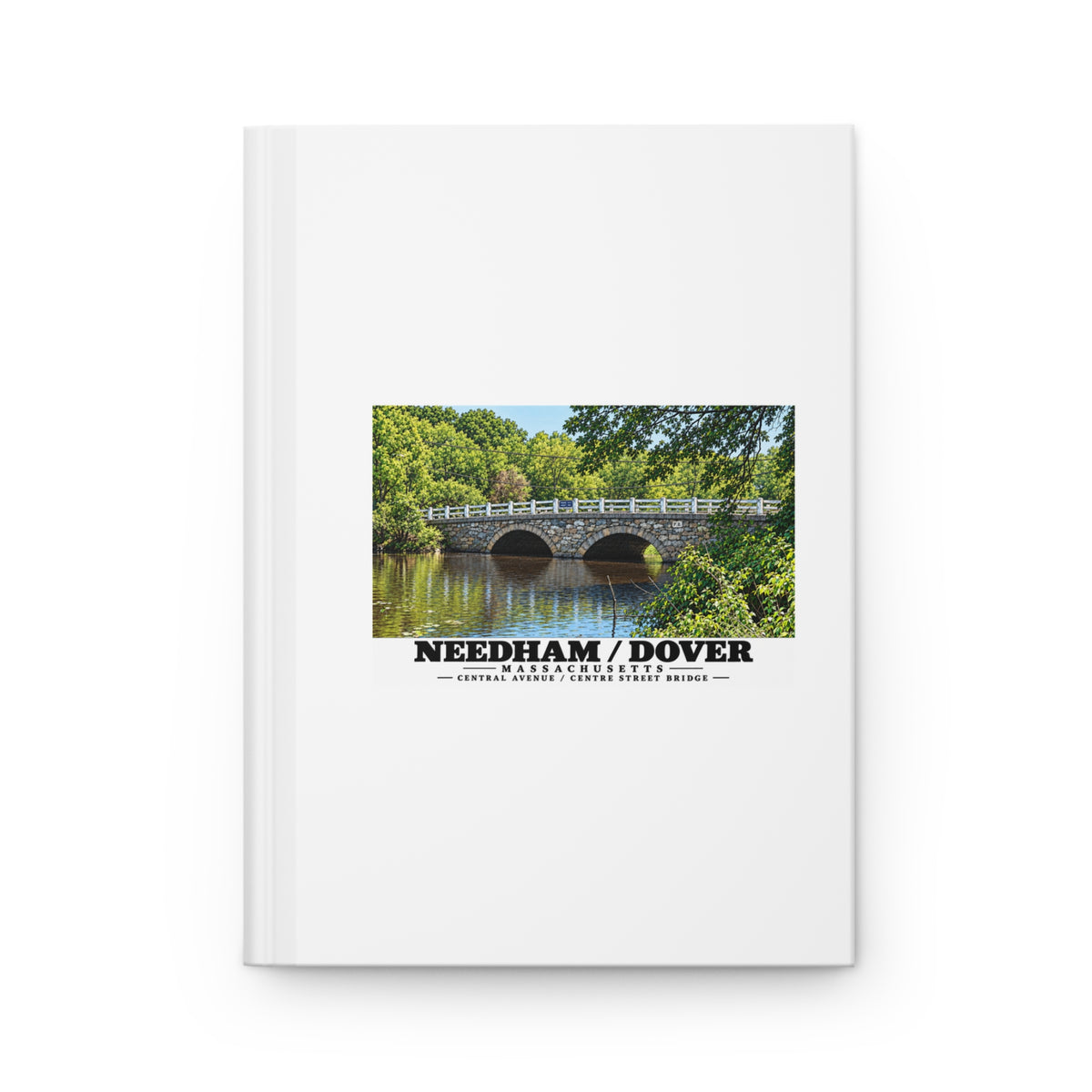 White hardcover journal with Central Avenue / Centre Street Bridge stone arches and river artwork and Needham/Dover lettering