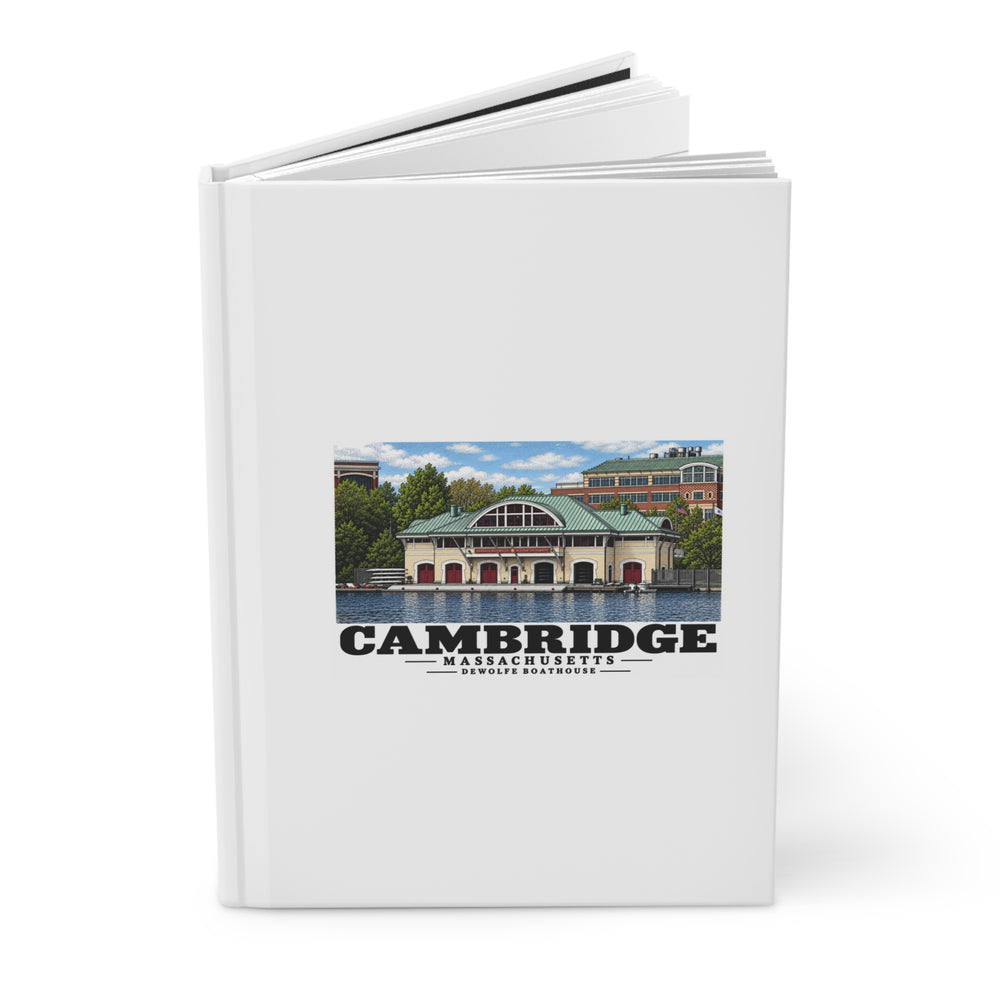 Angled view of the partly open hardcover journal with Cambridge DeWolfe Boathouse artwork on its front cover.