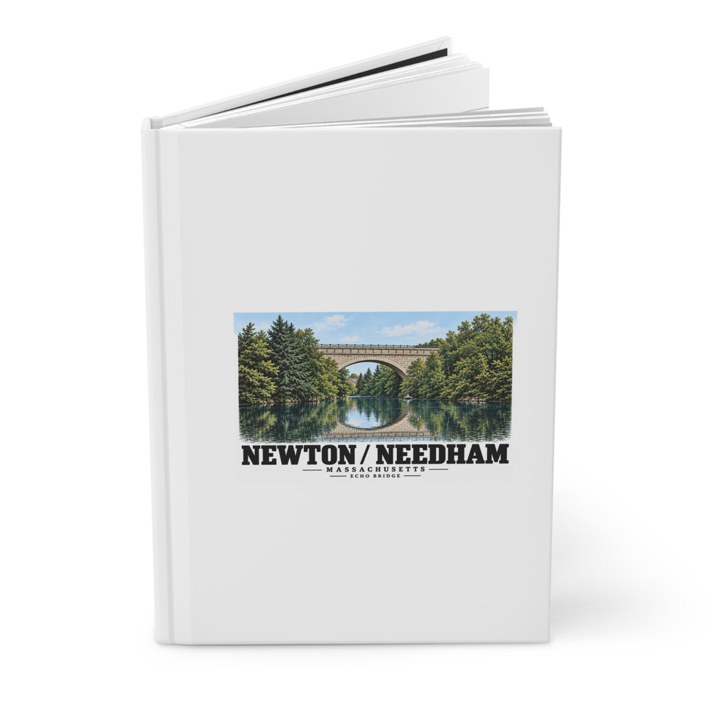 Partly opened journal showing its cover with Echo Bridge artwork and Newton/Needham lettering