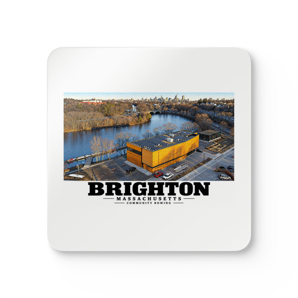 White square coaster showing Community Rowing aerial building and river artwork and Brighton lettering