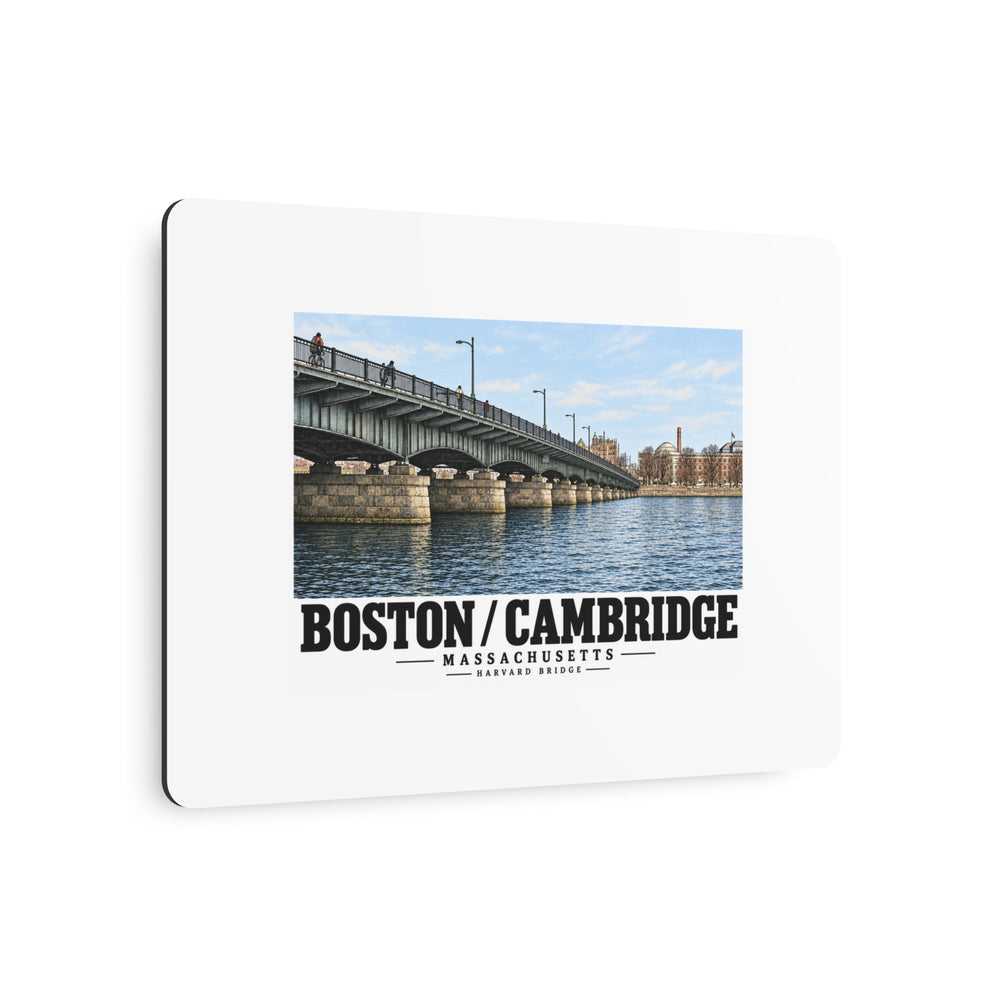 Angled metal sign showing Harvard Bridge artwork and Boston/Cambridge lettering and the edge
