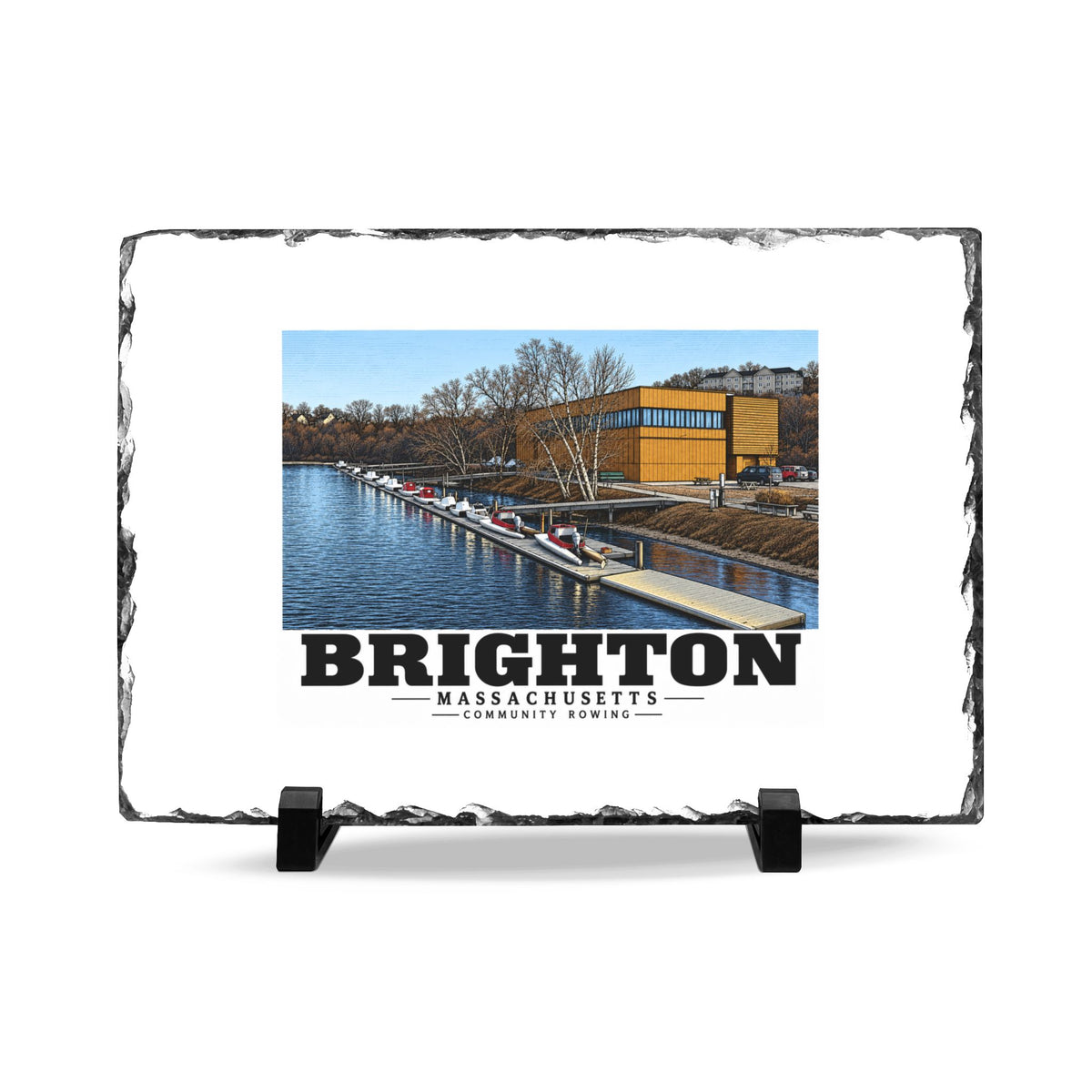 Rough-edged slate display on two black stands with Community Rowing building, dock and boats artwork and Brighton lettering