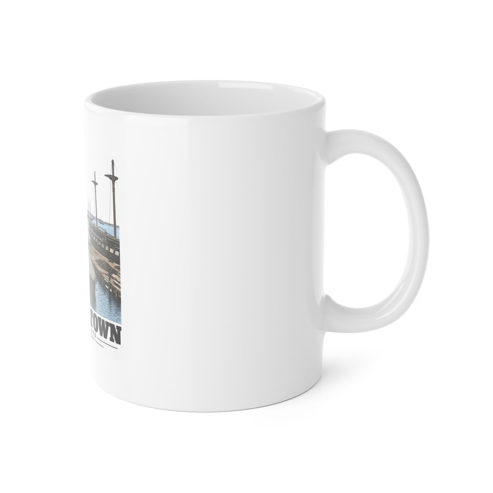 Right side of ceramic mug showing handle and edge of Navy Yard waterfront artwork