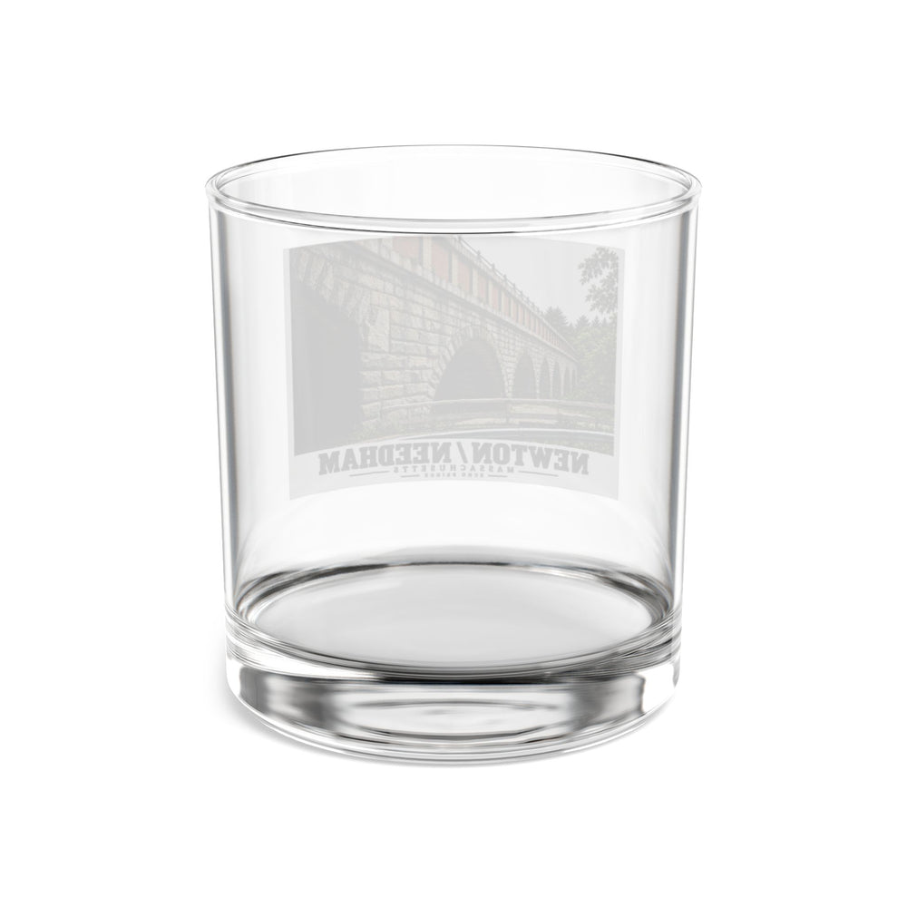 Reverse view of a clear rocks glass with the Echo Bridge design faintly visible through the glass.