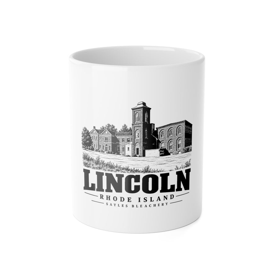 Front view of a white ceramic mug with black-and-white Lincoln, Rhode Island artwork of Sayles Bleachery