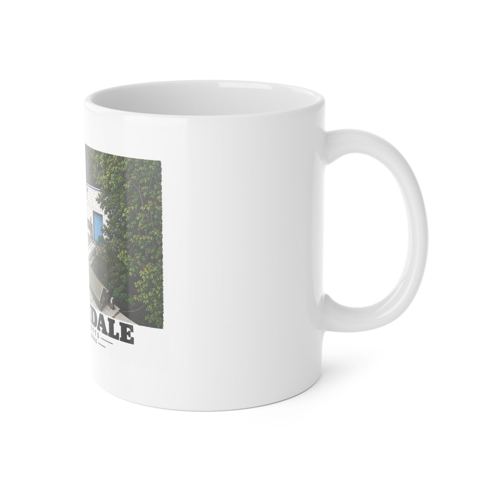 Right-handle view of the white ceramic mug with Stoller Boathouse artwork partly visible.