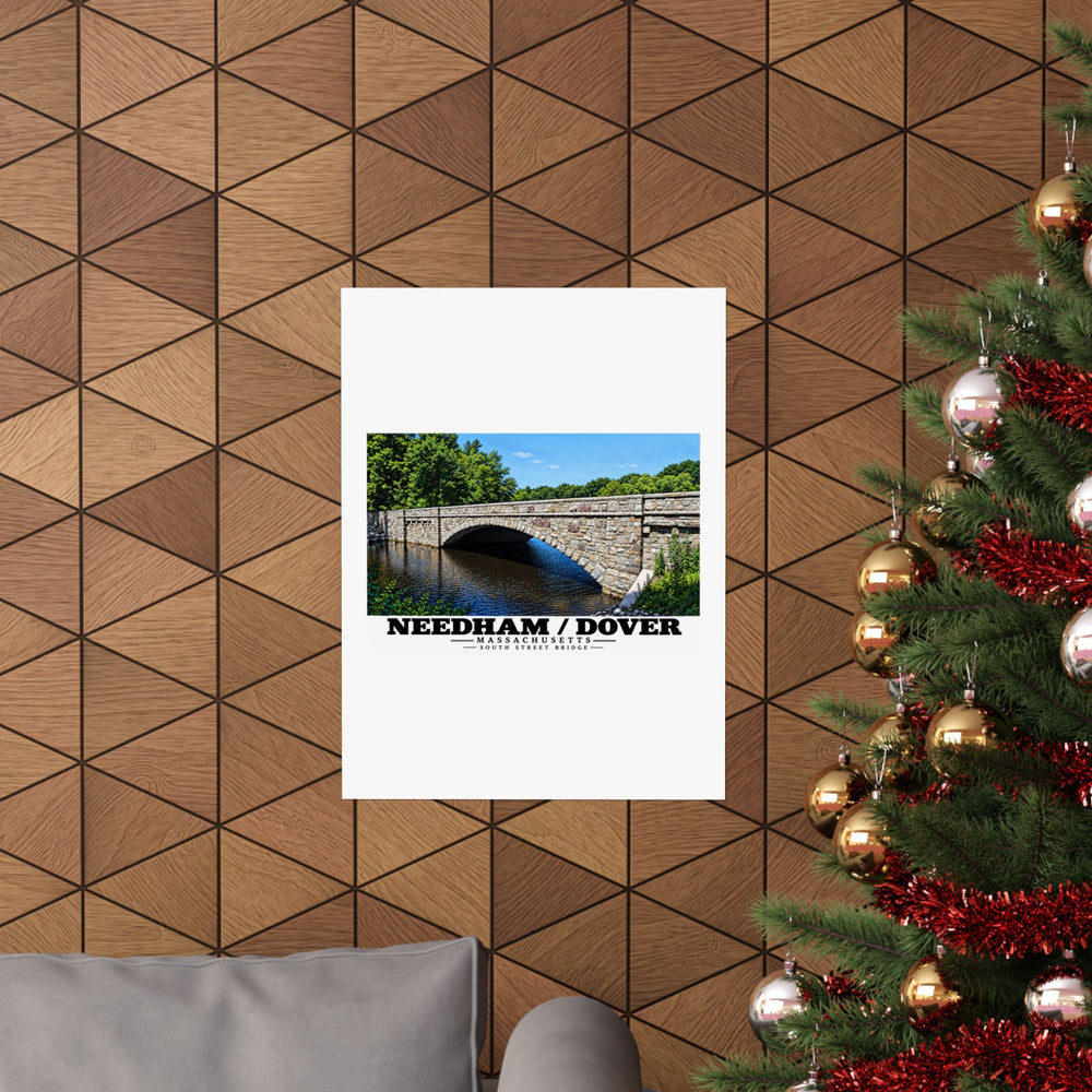 South Street Bridge stone arch and river poster on a wood wall beside a decorated evergreen
