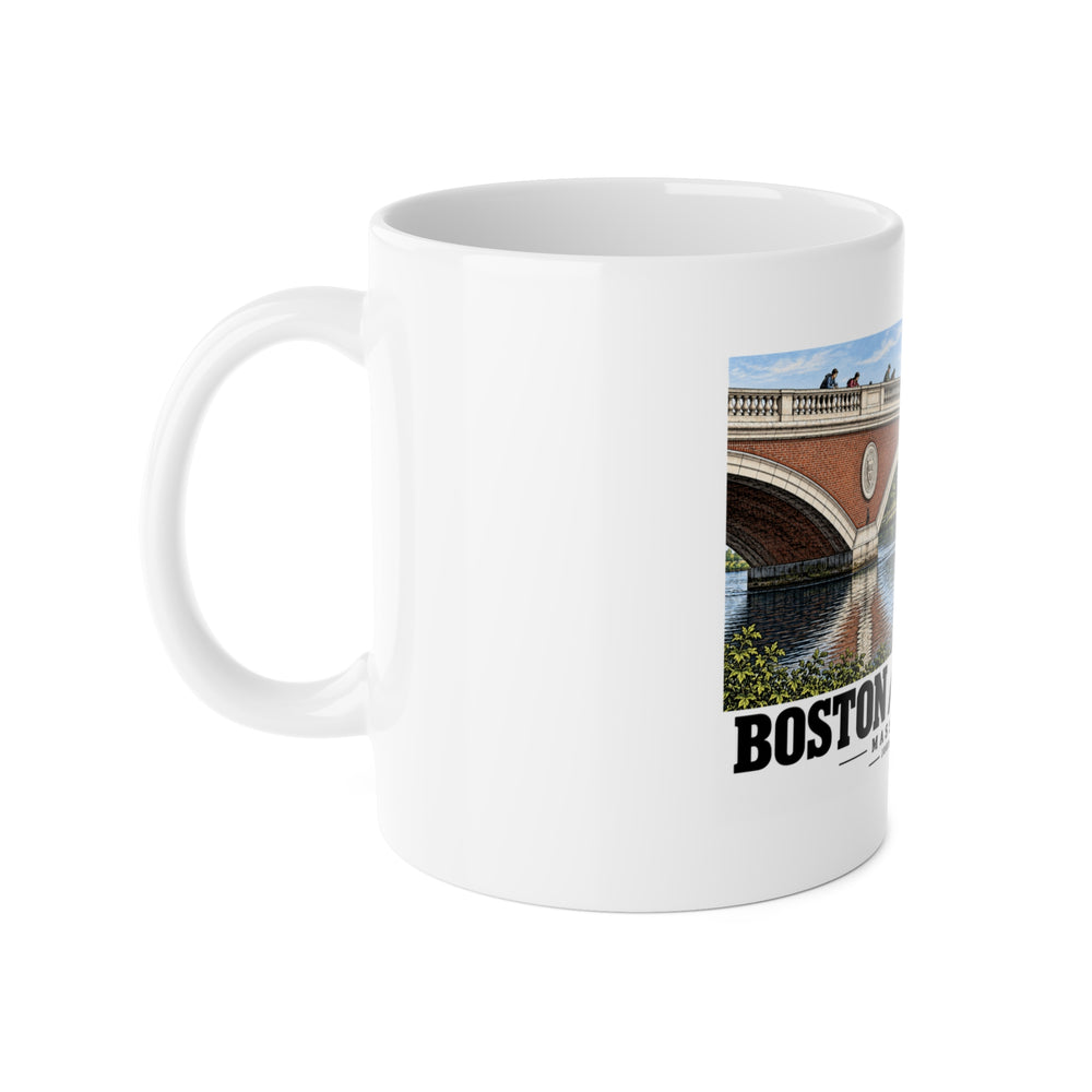 White mug with handle at left and part of the John W. Weeks Bridge and scullers print at right
