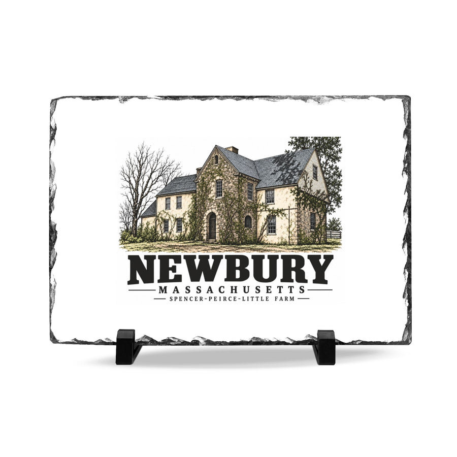 Front on display stands of Spencer-Peirce-Little Farm slate desk plaque, with Newbury, Massachusetts artwork and lettering.
