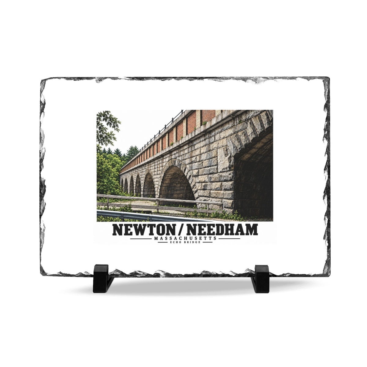 Slate plaque front on two black supports with Echo Bridge artwork showing a row of stone arches and a brick upper band, with Newton/Needham lettering and a rough dark stone border.