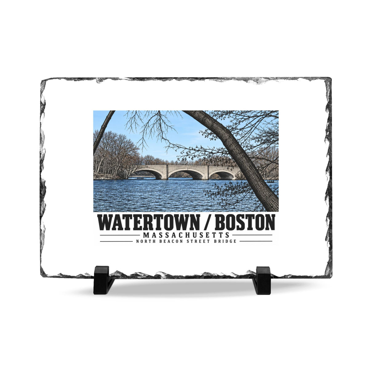 Rough-edged slate display on two black stands with North Beacon Street Bridge stone arches framed by a bare tree artwork and Watertown/Boston lettering