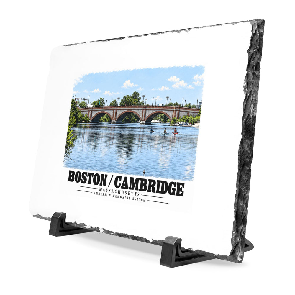 Angled rough-edged slate display on black stands showing Anderson Memorial Bridge and scullers artwork