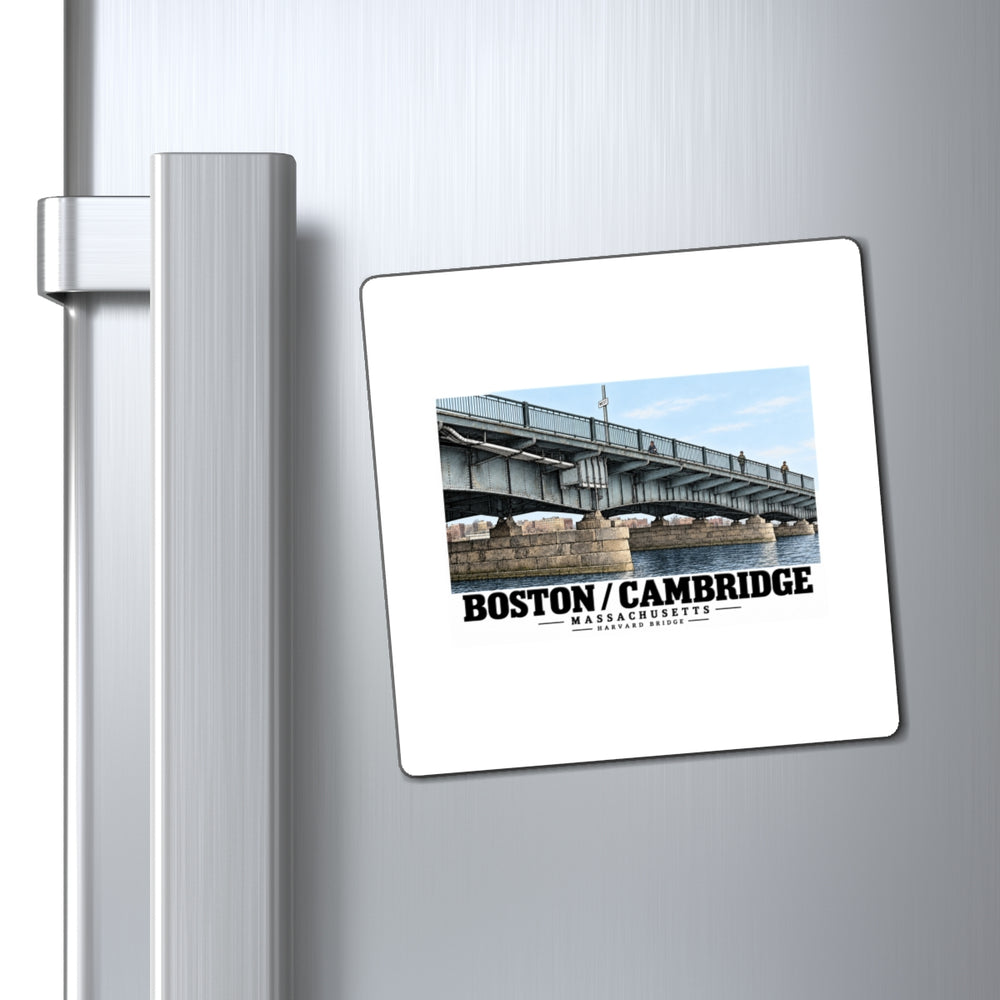 Magnet with Harvard Bridge artwork and Boston/Cambridge lettering on a refrigerator beside the handle