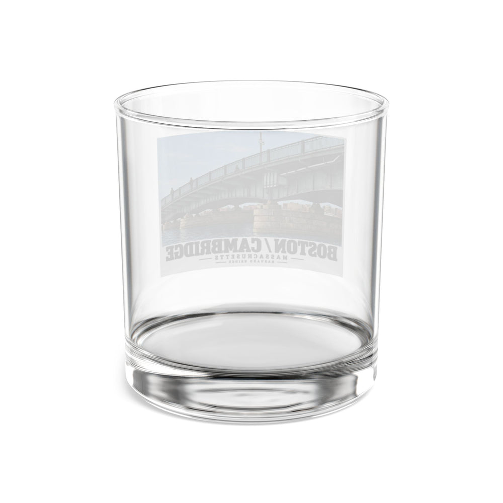 Clear rocks glass rear view showing the reversed Harvard Bridge print through the glass