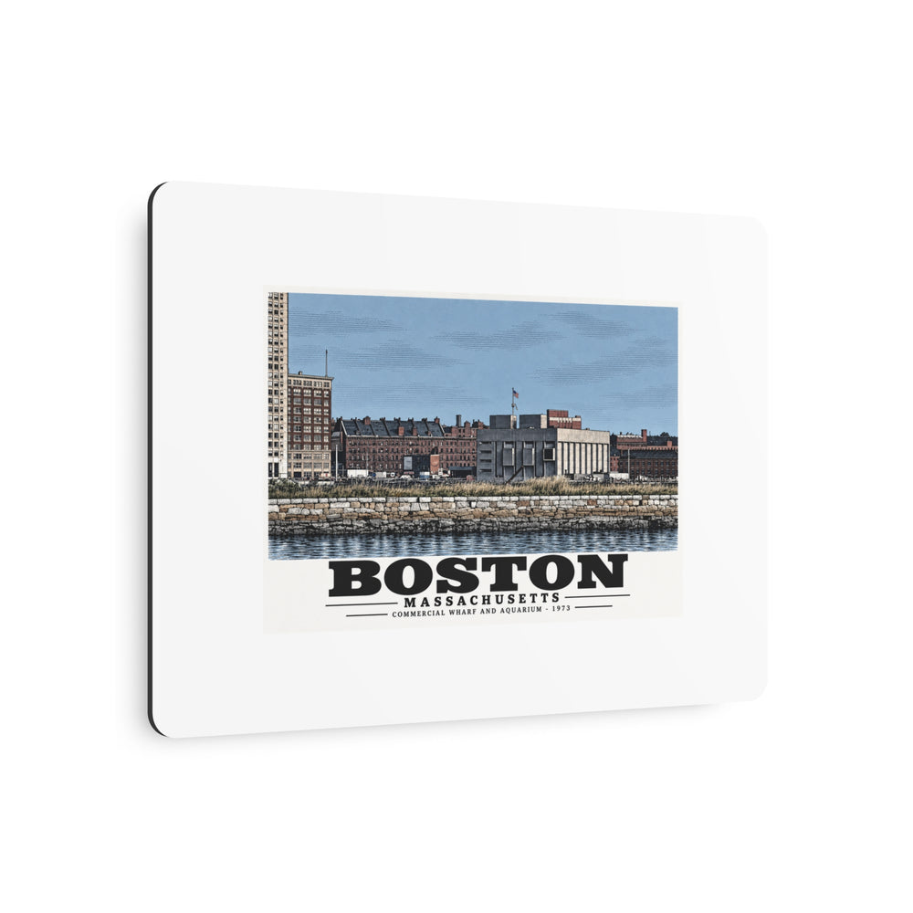 Angled view of Commercial Wharf and Aquarium waterfront buildings, stone seawall and harbor water metal print with its dark edge visible