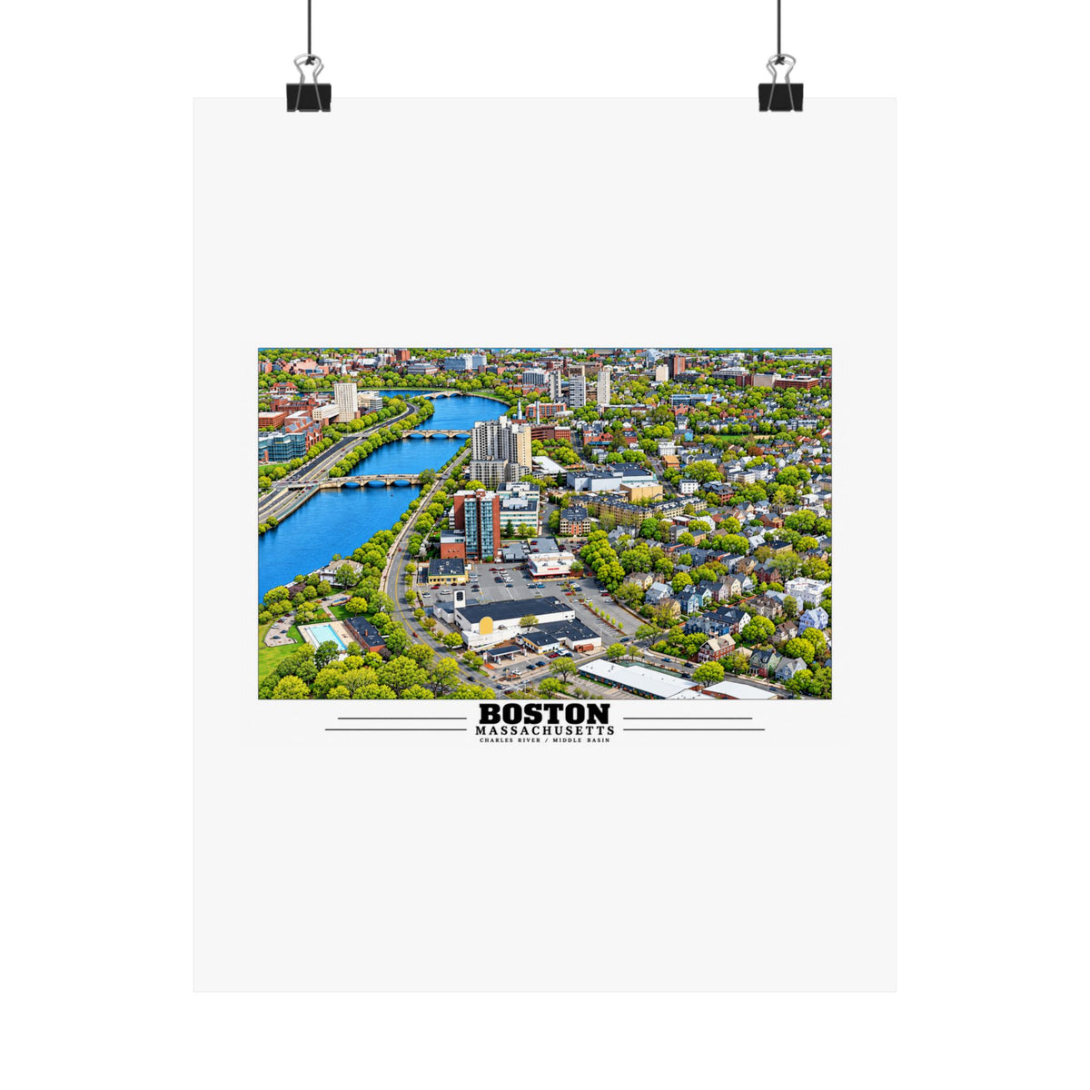 Charles River aerial city view with bridges, buildings and green trees poster with Boston lettering hanging from two binder clips
