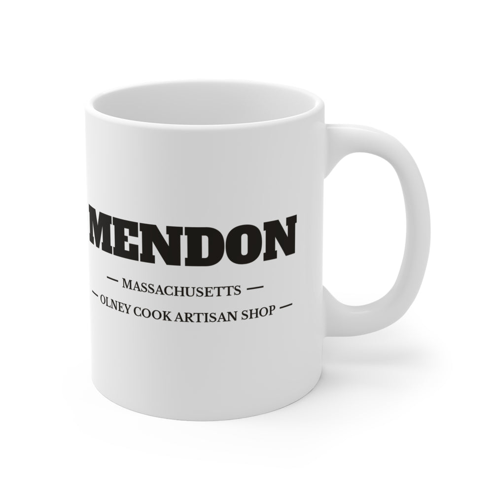 Mendon Olney Cook Artisan Shop 11 oz ceramic mug — lettering view, handle right — Familiar History