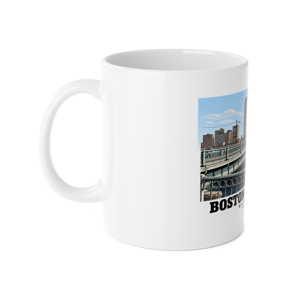 White mug with handle on the left and part of the Harvard Bridge print visible on the right