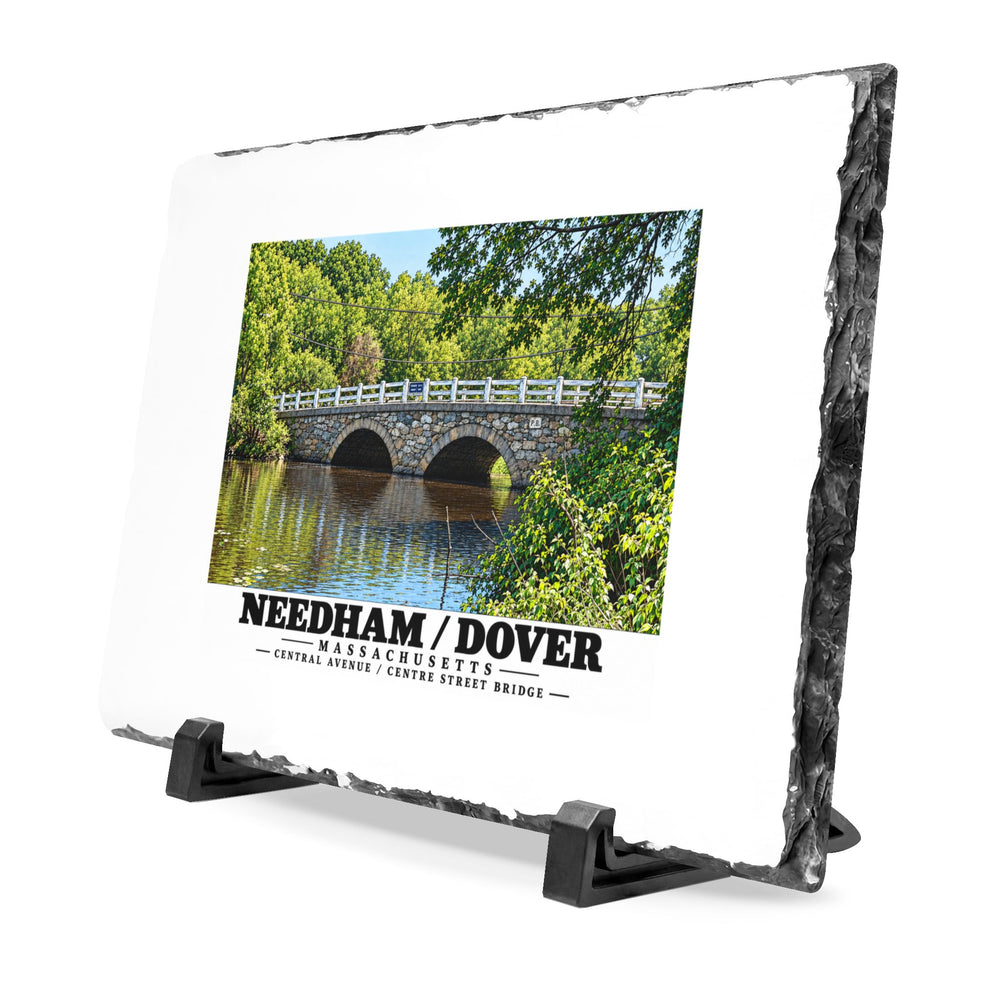 Angled rough-edged slate display on black stands showing Central Avenue / Centre Street Bridge stone arches and river artwork