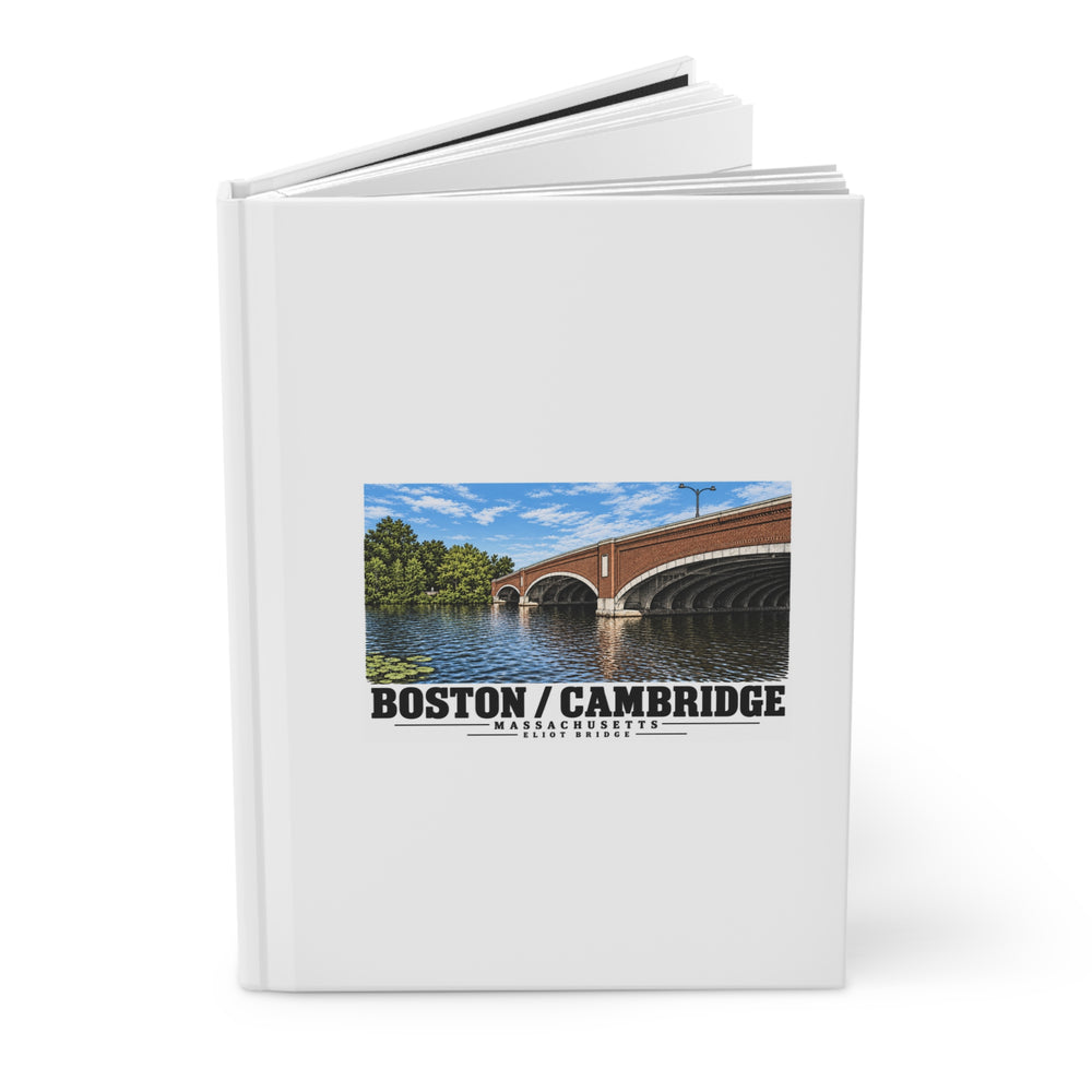 Partly opened white hardcover journal showing Eliot Bridge close red brick arch view artwork on the front