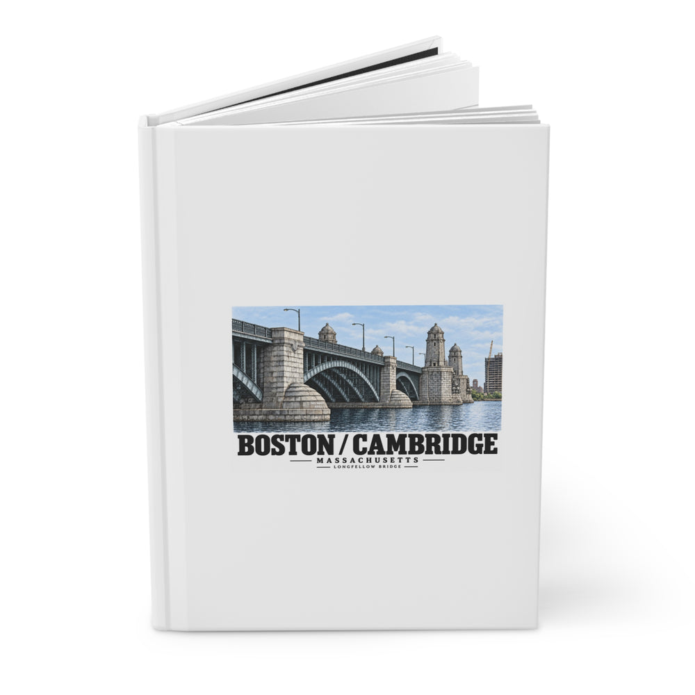 Partly opened hardcover journal with the Longfellow Bridge design visible on its front cover.