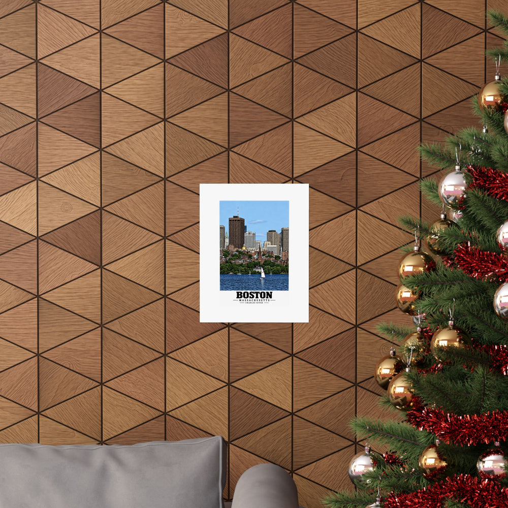 Boston and Charles River poster on a wood-patterned wall beside a decorated evergreen.