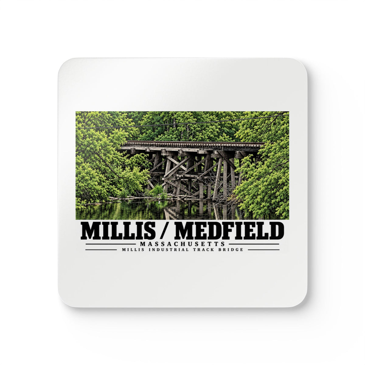 White square coaster showing Millis Industrial Track wooden railway trestle and green foliage artwork and Millis/Medfield lettering