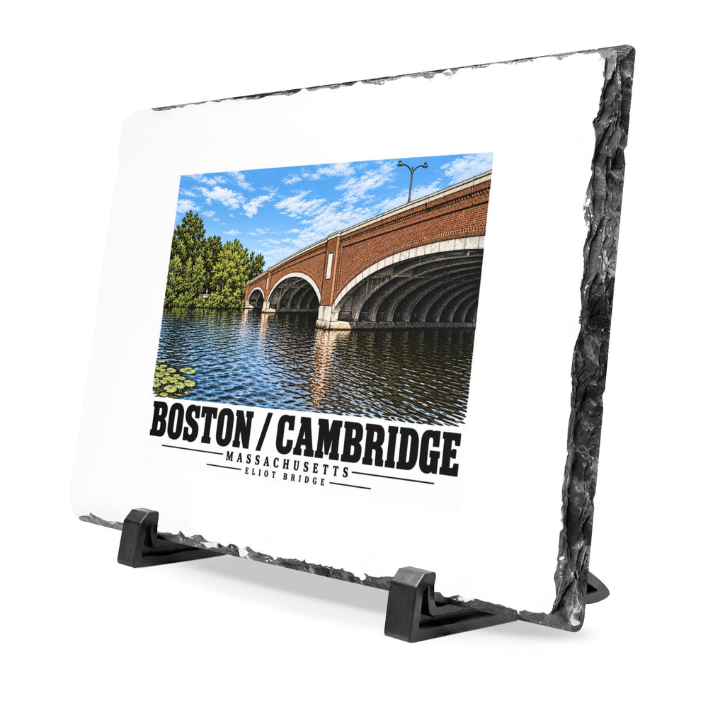 Angled rough-edged slate display on black stands showing Eliot Bridge close red brick arch view artwork
