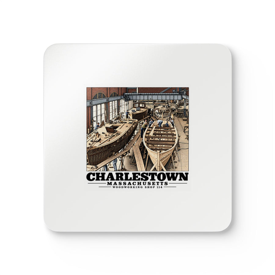 Front of four-piece coaster set with small-boat building artwork and Charlestown lettering