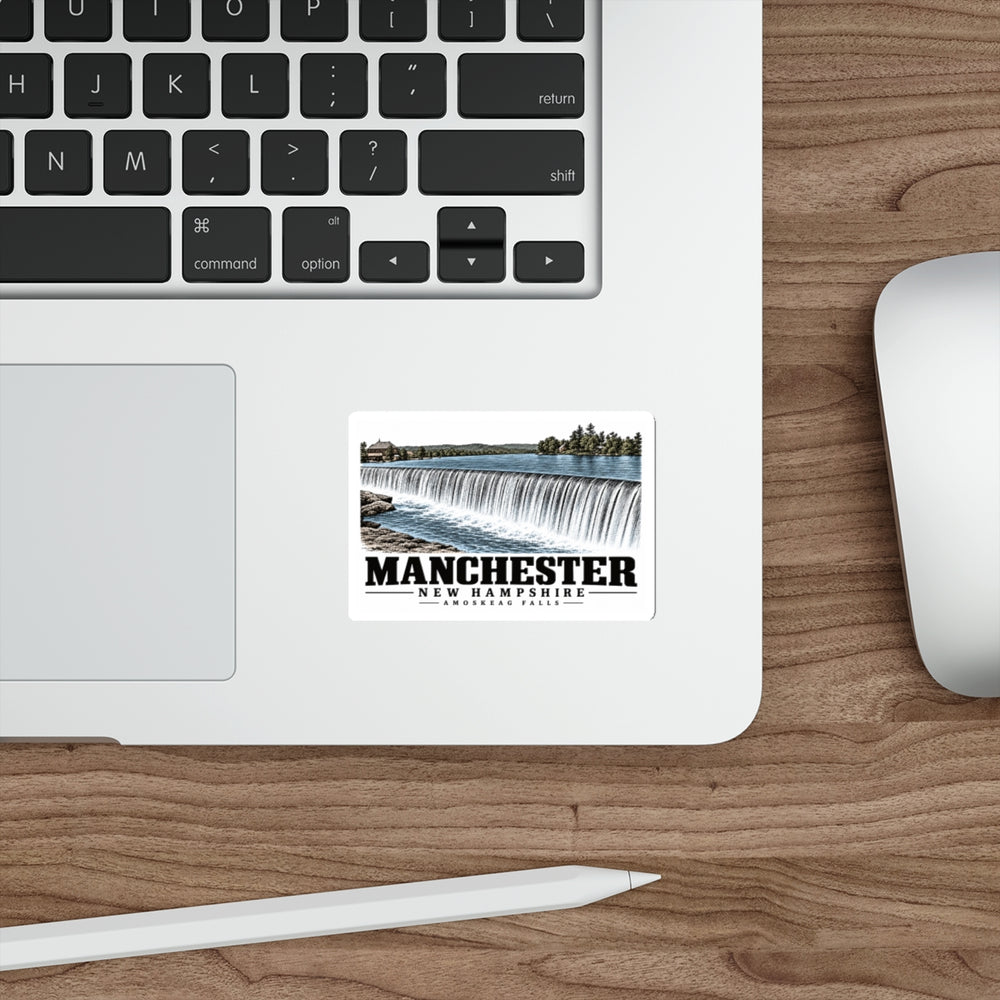 Laptop display of Amoskeag Falls white die-cut sticker, with Manchester, New Hampshire artwork and lettering.