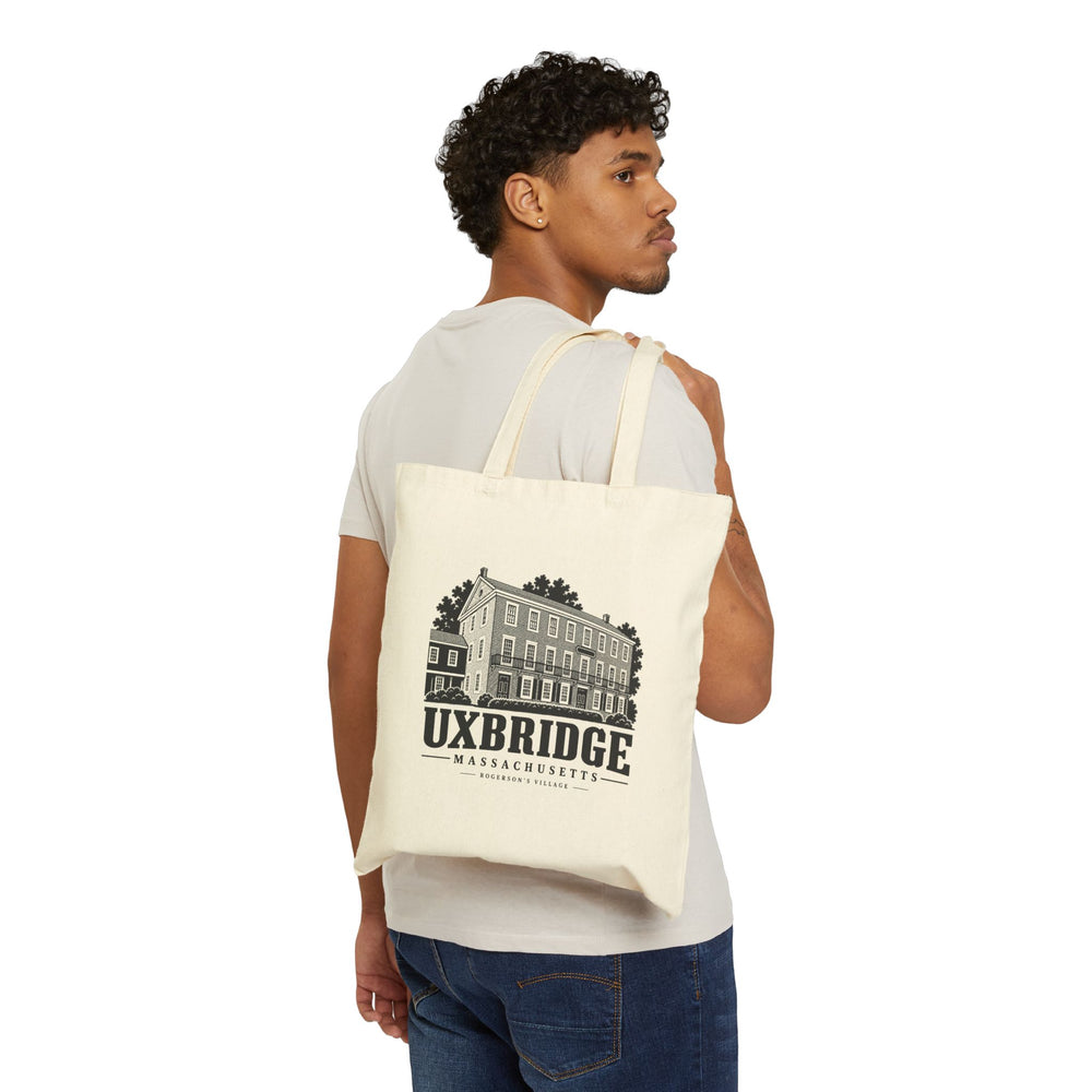 Natural canvas tote with Uxbridge Rogerson's Village artwork shown worn over the shoulder