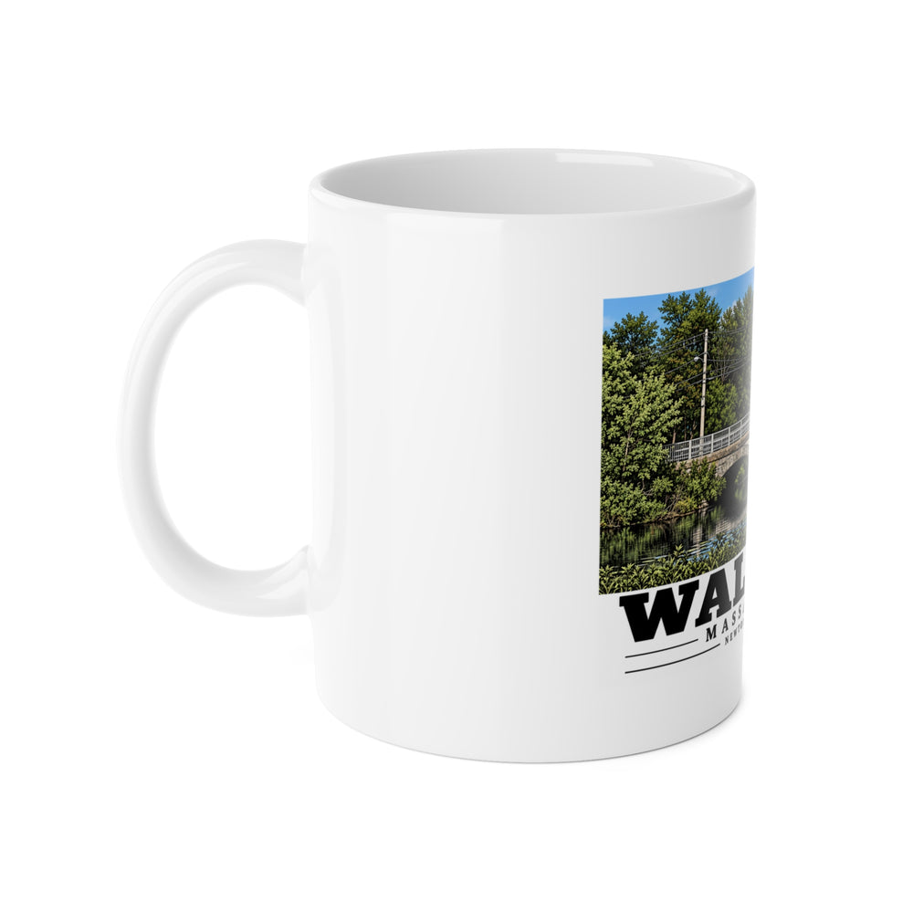 Left-handle view of the white ceramic mug with Newton Street Bridge artwork partly visible.