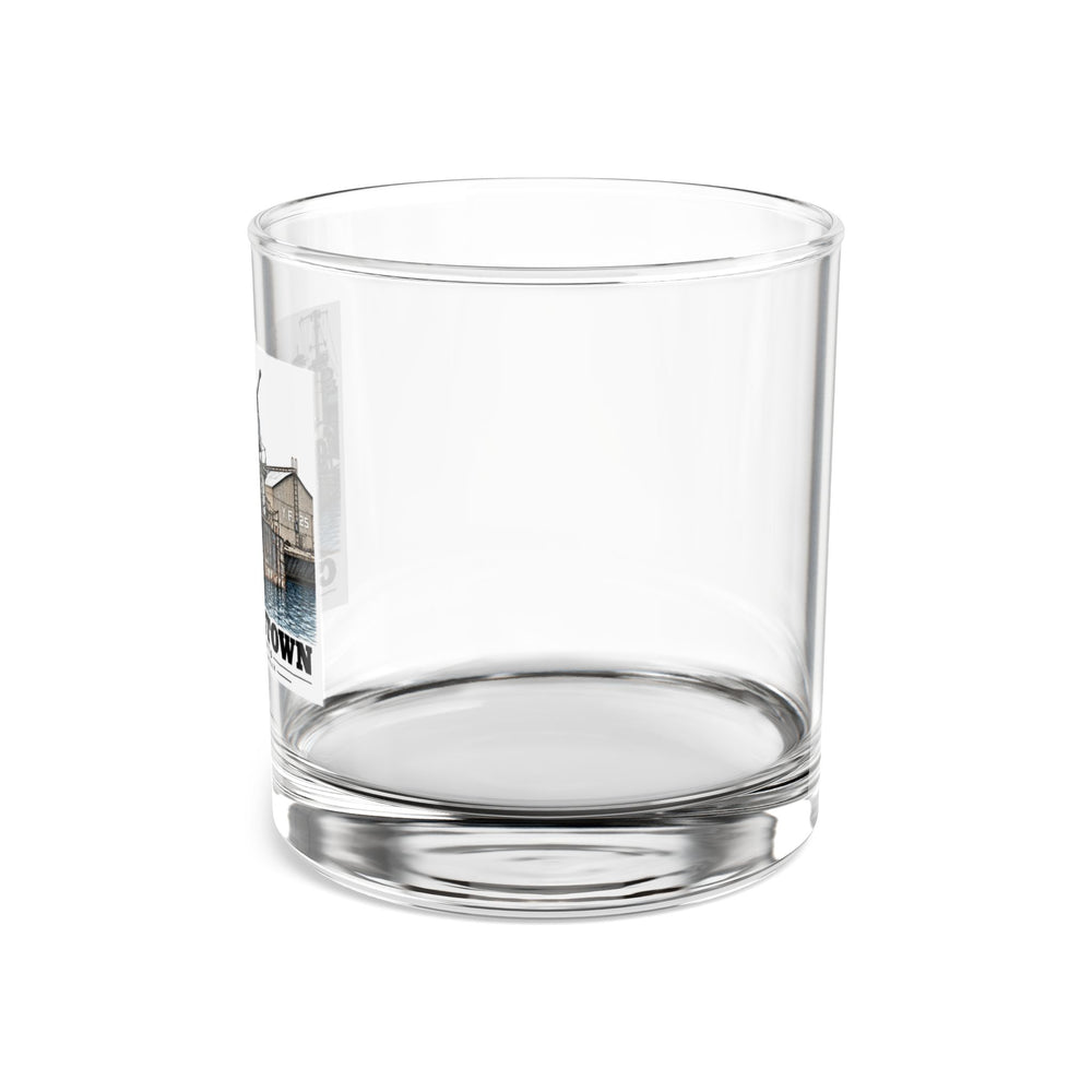 Left side of clear rocks glass showing partial USS Nelson artwork