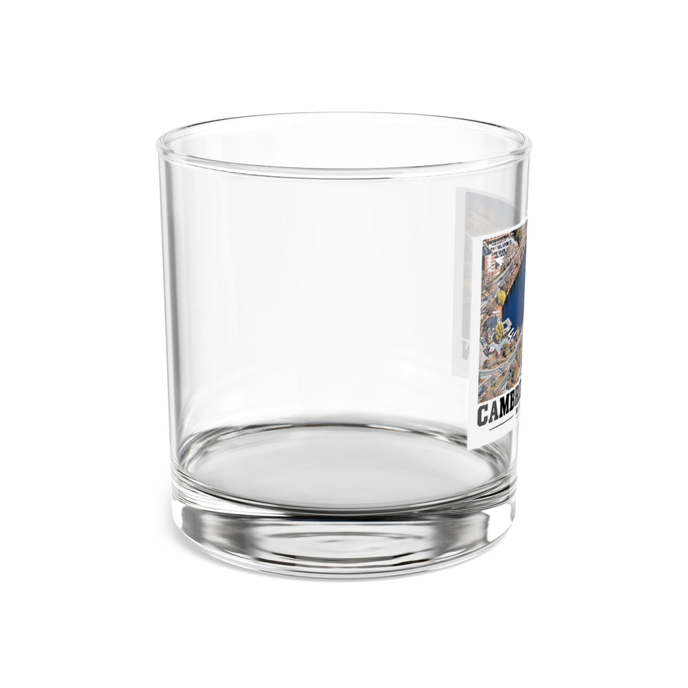 Side view of clear rocks glass with mostly unprinted surface and part of Eliot Bridge aerial river view print at right