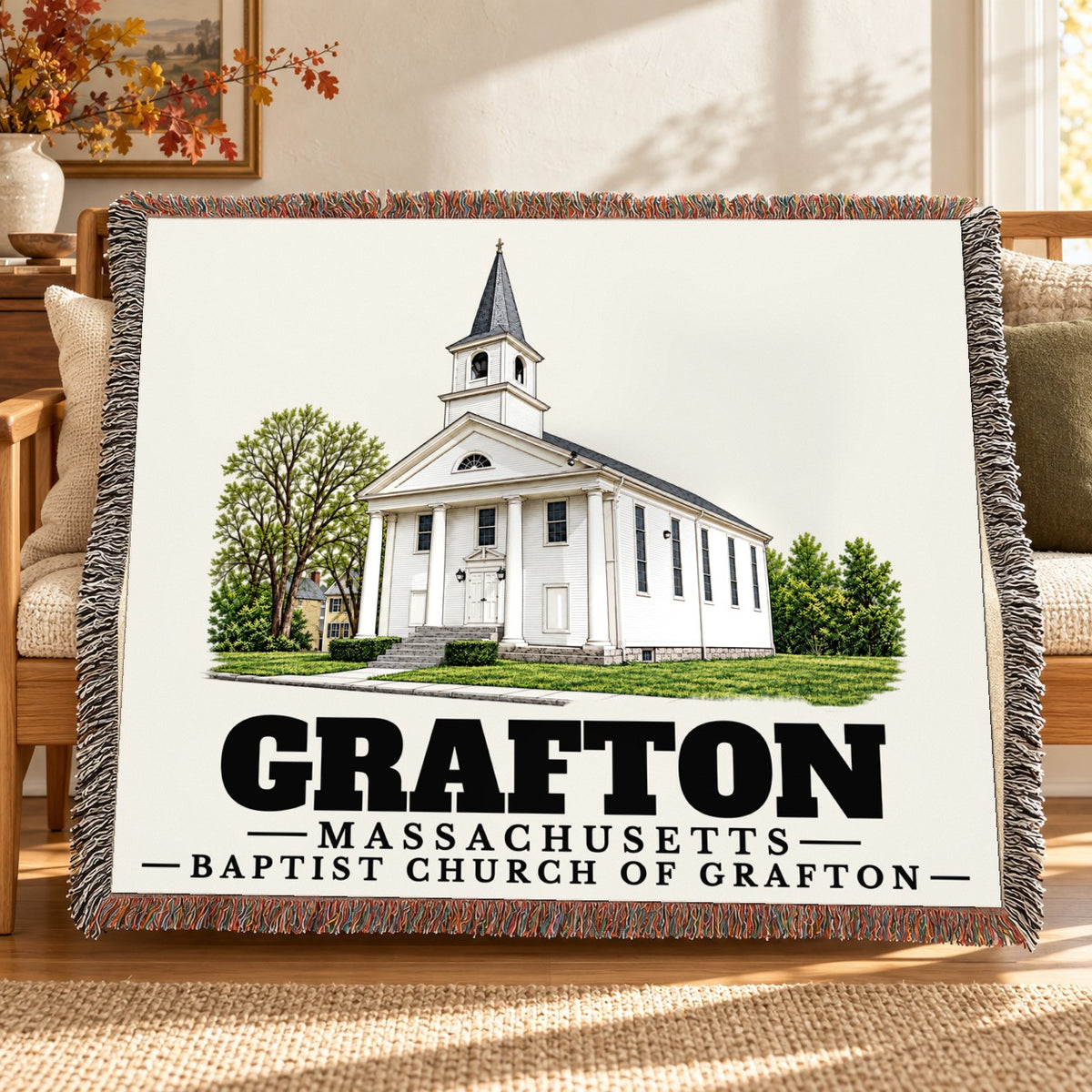 Baptist Church of Grafton woven blanket draped on a sofa in a living room — Grafton, Massachusetts
