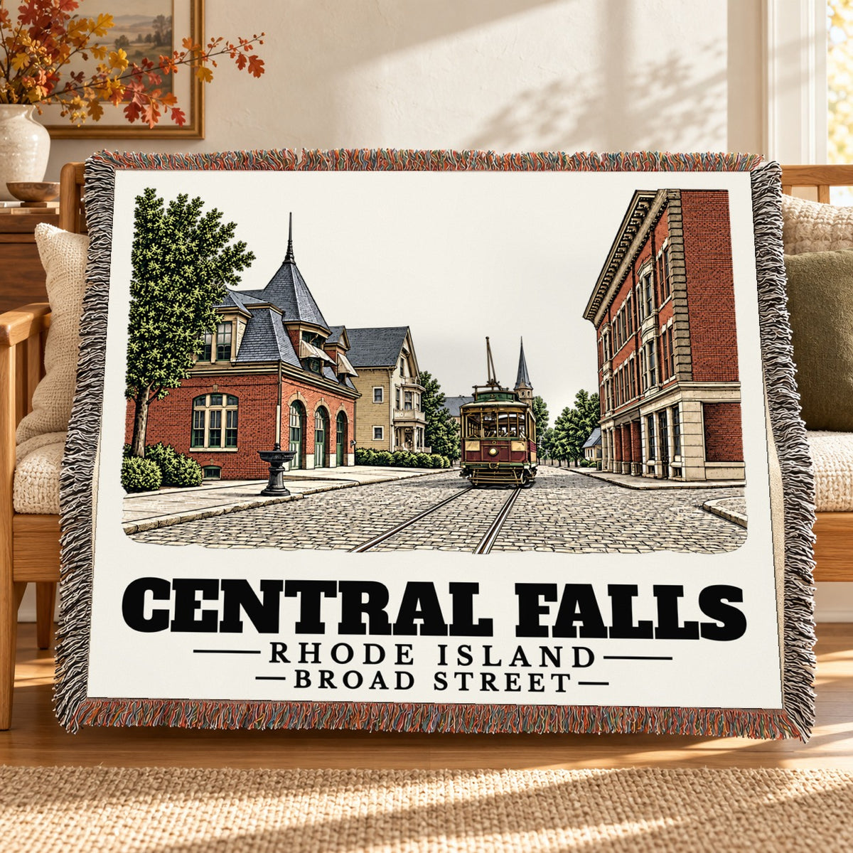 Broad Street woven blanket draped on a sofa in a living room — Central Falls, Rhode Island