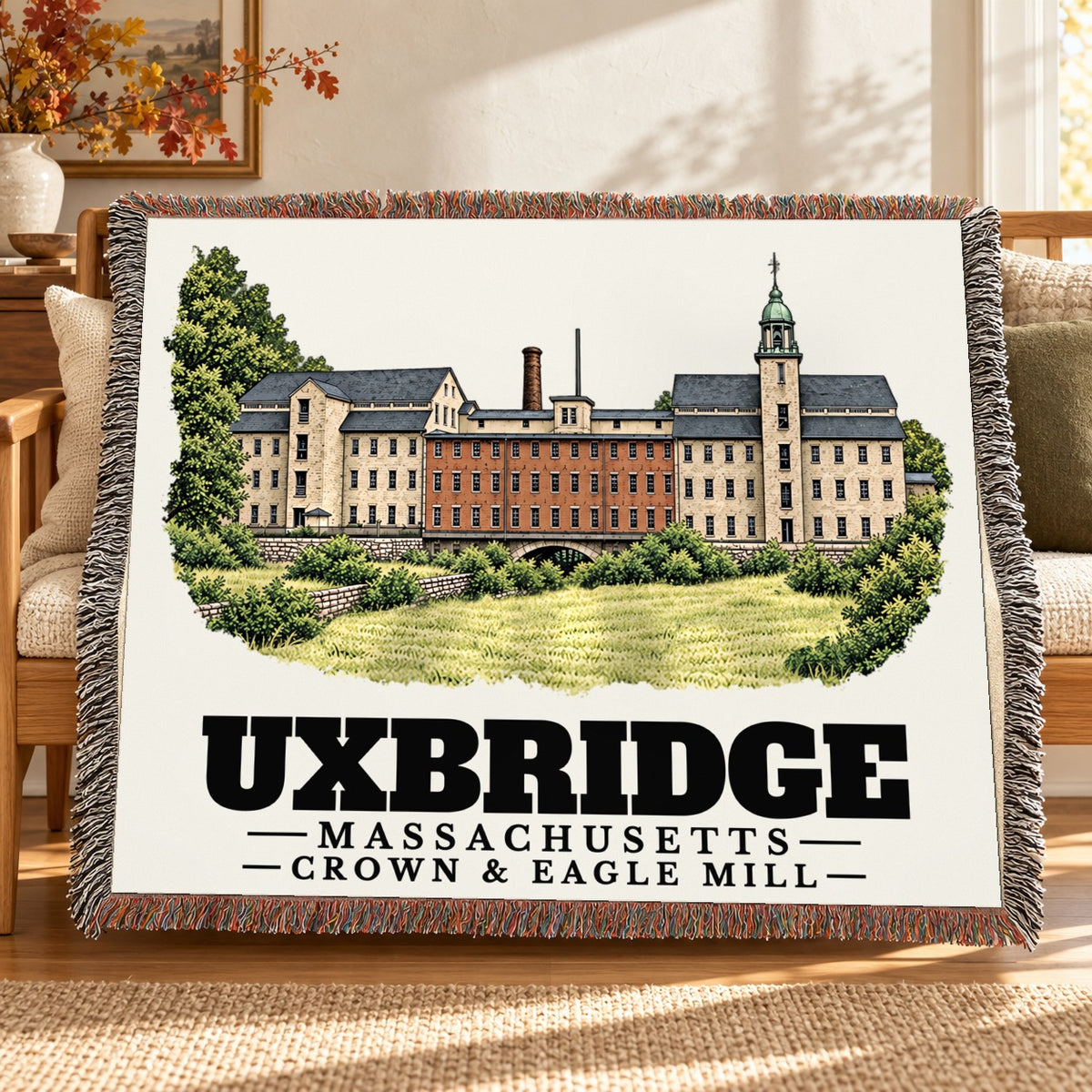 Crown & Eagle Mill woven blanket draped on a sofa in a living room — Uxbridge, Massachusetts