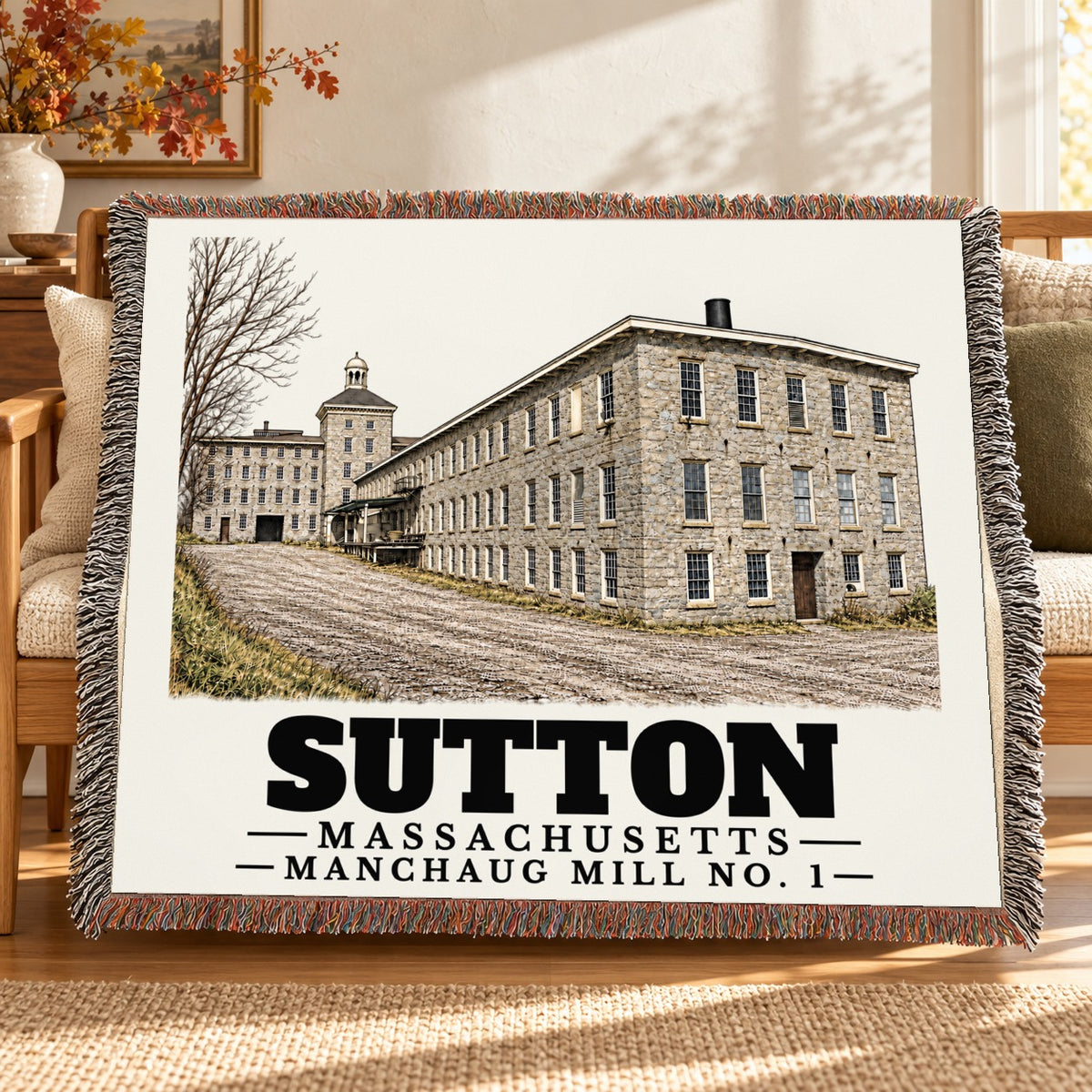 Manchaug Mill No. 1 woven blanket draped on a sofa in a living room — Sutton, Massachusetts