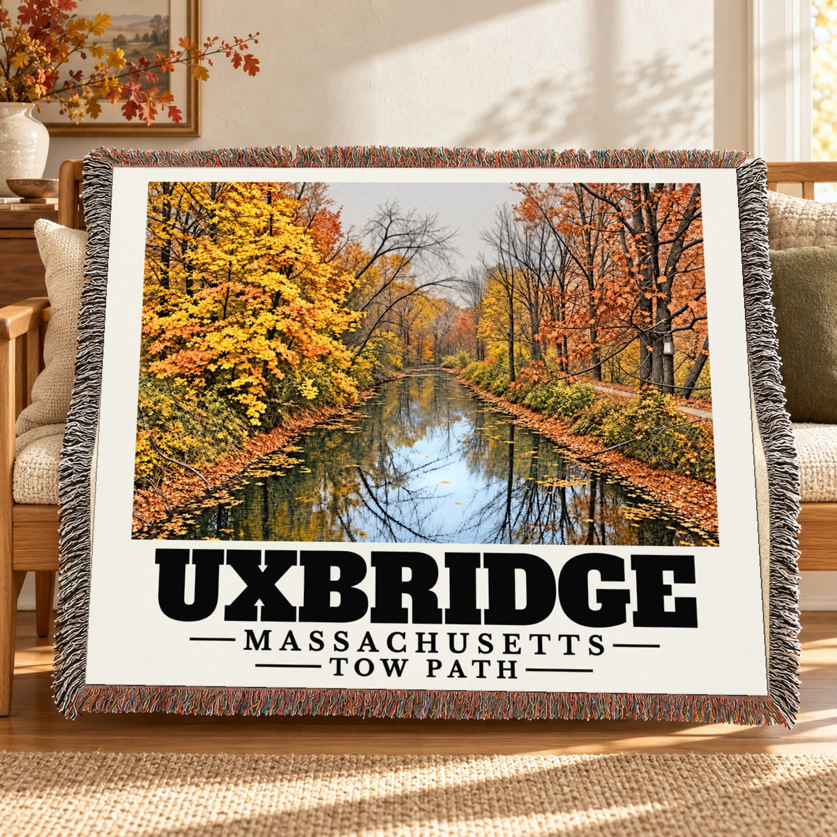 Tow Path woven blanket draped on a sofa in a living room — Uxbridge, Massachusetts