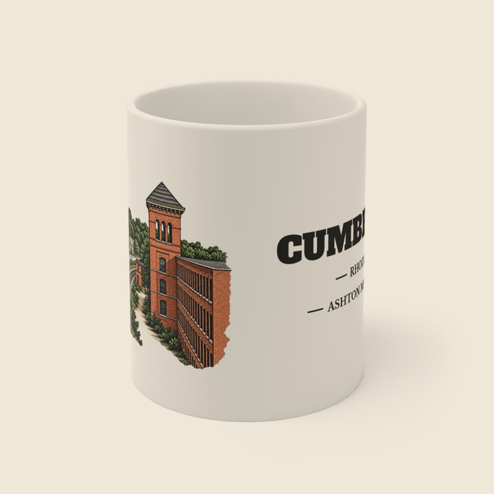 Cumberland Ashton Mill & Village colored engraving on an 11 oz white ceramic mug, cream display background