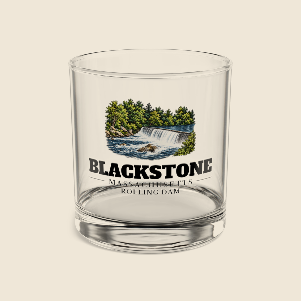 Blackstone Rolling Dam rocks glass with colored engraving, shown on a cream background