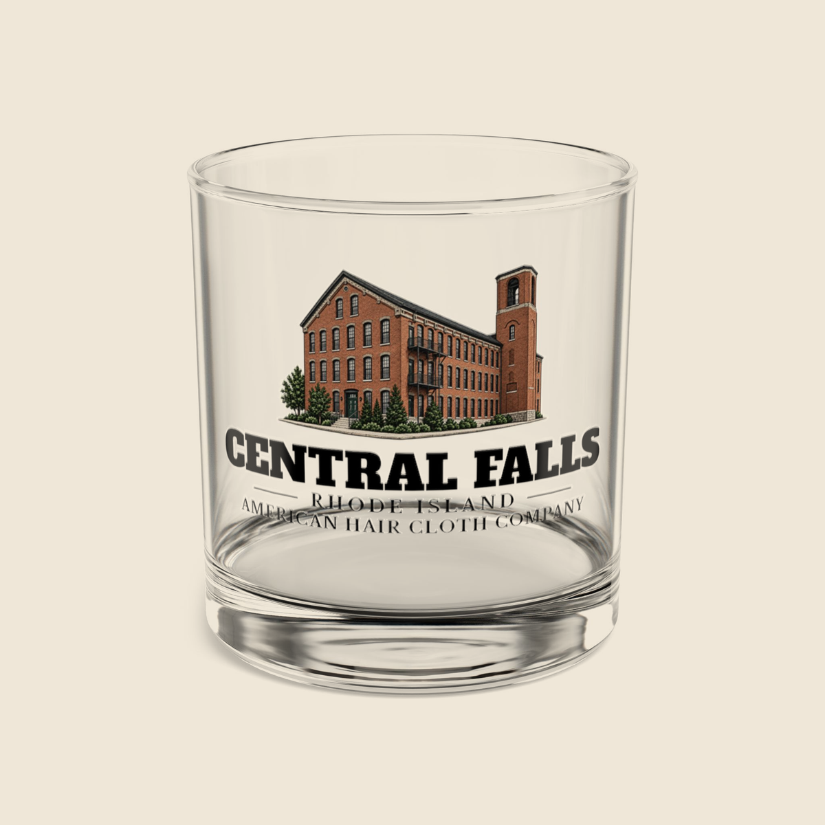 Central Falls American Hair Cloth Company rocks glass with colored engraving, shown on a cream background